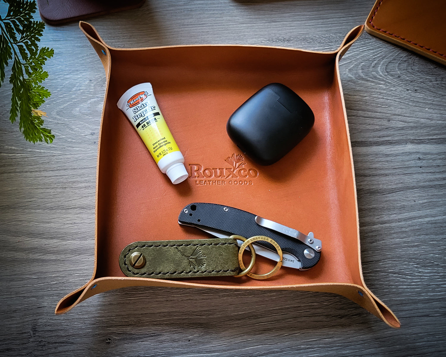 Catchall EDC tray made from tan Wickett & Craig leather with EDC Key organizer, Kershaw Chill knife, and other items